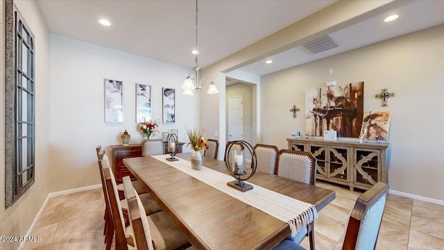 dining room featuring a notable chandelier