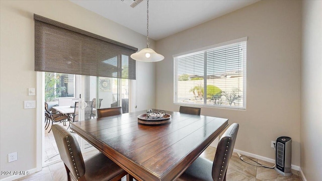 dining space with plenty of natural light