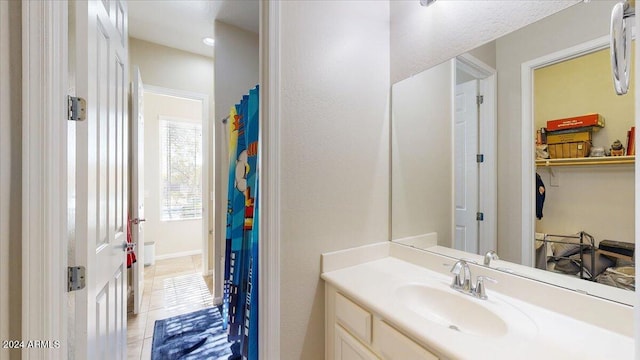 bathroom featuring tile patterned floors and vanity