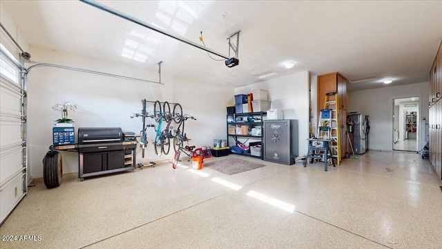 garage with stainless steel fridge and a garage door opener