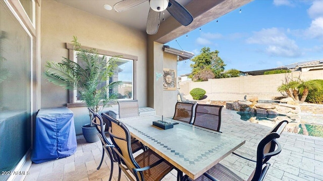 view of patio featuring ceiling fan