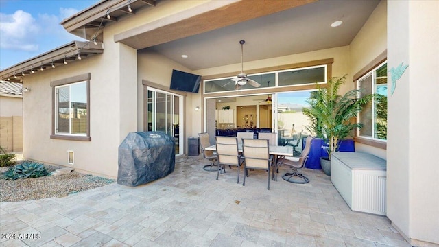 view of patio with area for grilling and ceiling fan