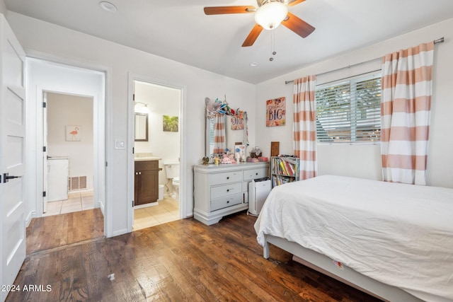 bedroom with dark hardwood / wood-style floors, connected bathroom, and ceiling fan