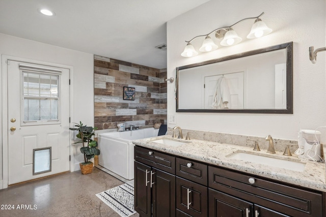 bathroom with vanity and a bathing tub