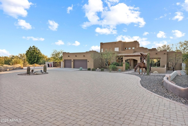 adobe home featuring a garage