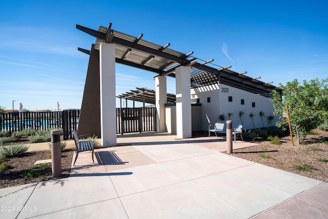 view of patio with fence and a pergola