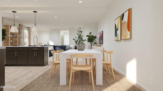 dining area with recessed lighting, baseboards, and light wood finished floors