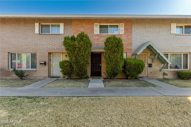 view of property featuring a front yard