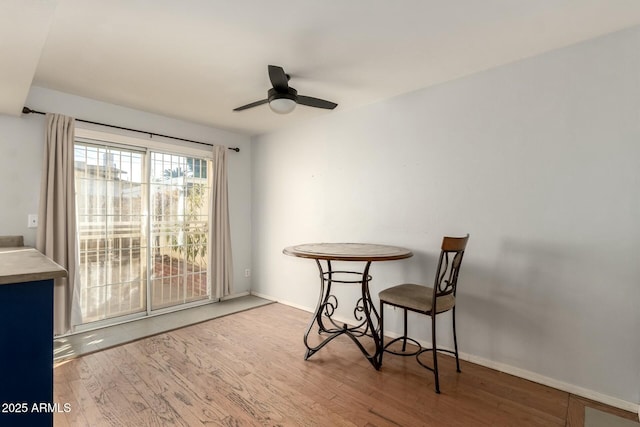 dining room featuring hardwood / wood-style floors and ceiling fan