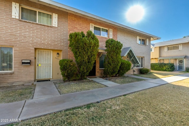 view of property featuring a front yard