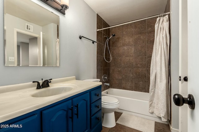 full bathroom with vanity, shower / tub combo, tile patterned floors, and toilet