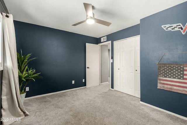 bedroom featuring carpet floors, ceiling fan, and a closet