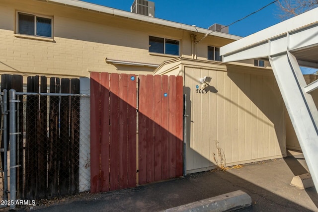 view of gate featuring central AC unit