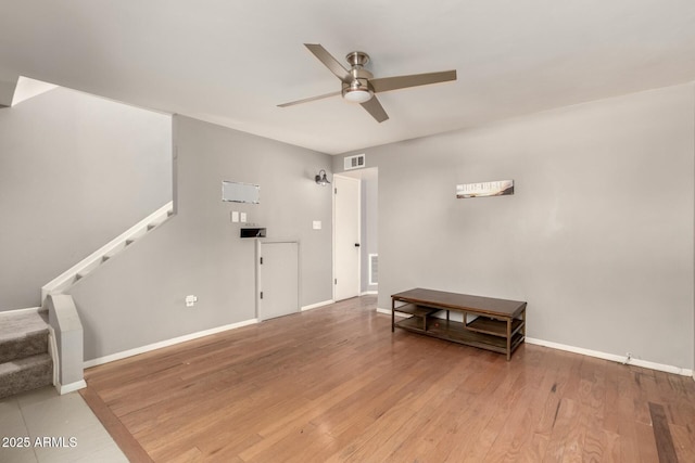 interior space with hardwood / wood-style floors and ceiling fan