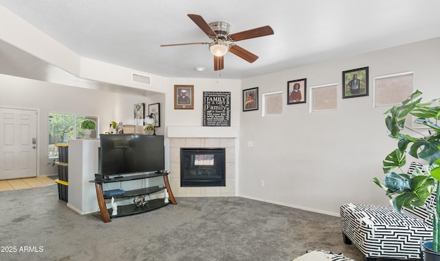 1374 E 10th Pl, Casa Grande, AZ 85122 - carpeted living area with ceiling fan and a fireplace
