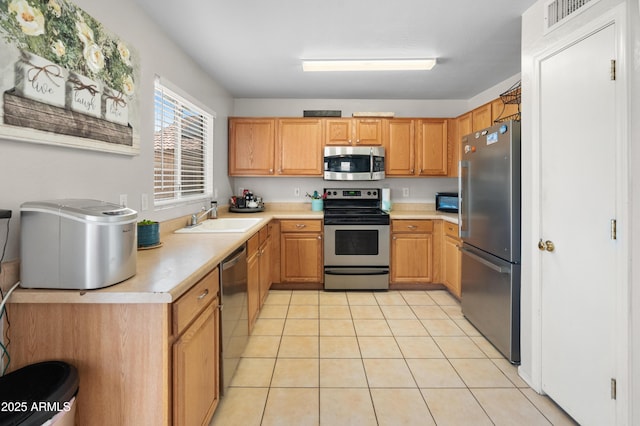 1374 E 10th Pl, Casa Grande, AZ 85122 - kitchen with appliances with stainless steel finishes, light countertops, and light tile patterned flooring