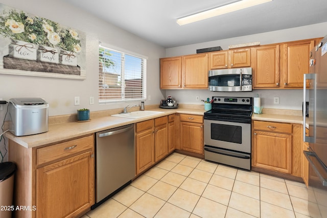 1374 E 10th Pl, Casa Grande, AZ 85122 - kitchen featuring appliances with stainless steel finishes, light countertops, and light tile patterned floors