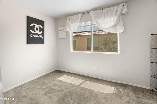 1374 E 10th Pl, Casa Grande, AZ 85122 - empty room featuring carpet flooring and baseboards