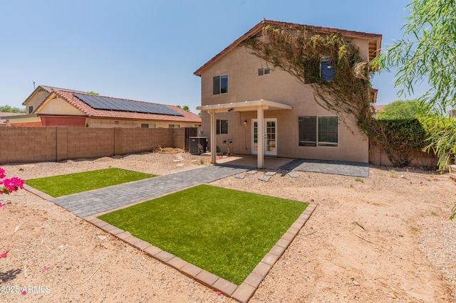 1374 E 10th Pl, Casa Grande, AZ 85122 - back of house with a fenced backyard, stucco siding, and a patio