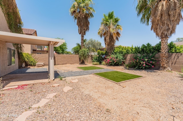 1374 E 10th Pl, Casa Grande, AZ 85122 - fenced backyard featuring a patio area