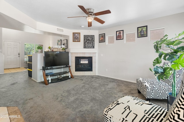 1374 E 10th Pl, Casa Grande, AZ 85122 - living area with carpet, ceiling fan, and a tile fireplace