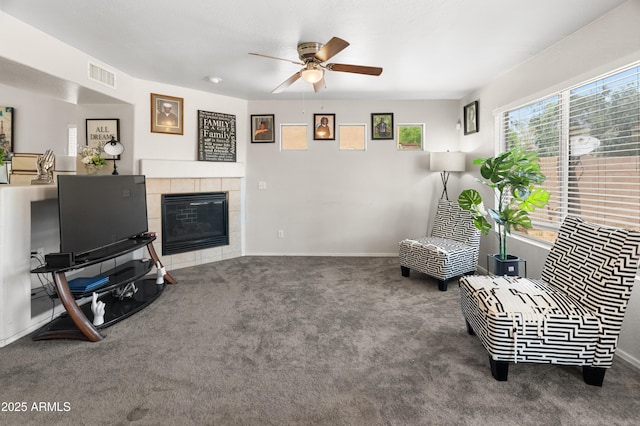 1374 E 10th Pl, Casa Grande, AZ 85122 - living area featuring a ceiling fan, carpet flooring, and a tiled fireplace