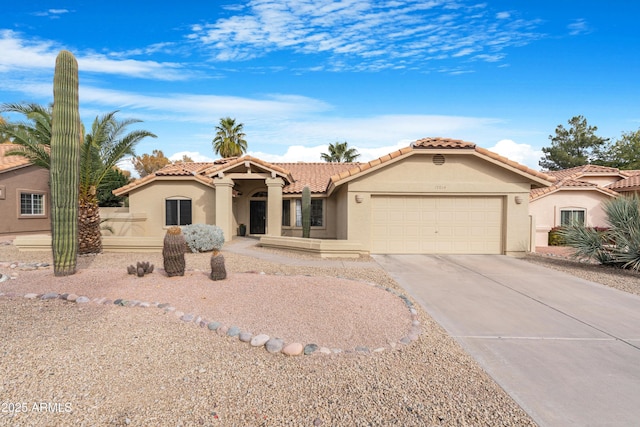 mediterranean / spanish-style home featuring a garage