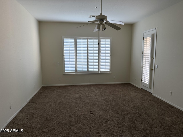 carpeted spare room featuring ceiling fan