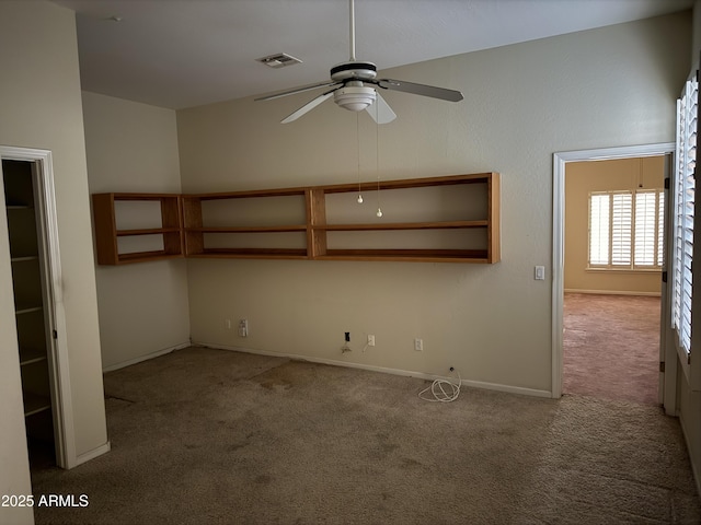 interior space with light colored carpet and ceiling fan