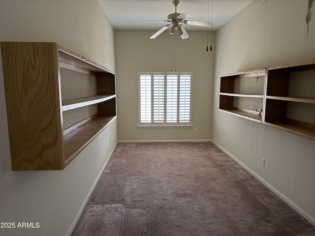 empty room with ceiling fan and carpet floors