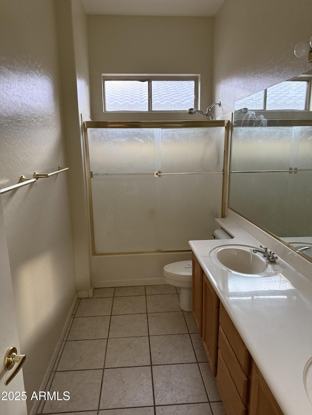 full bathroom featuring vanity,  shower combination, tile patterned floors, and toilet