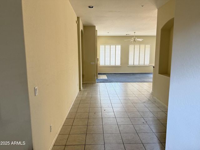 hallway featuring light tile patterned flooring