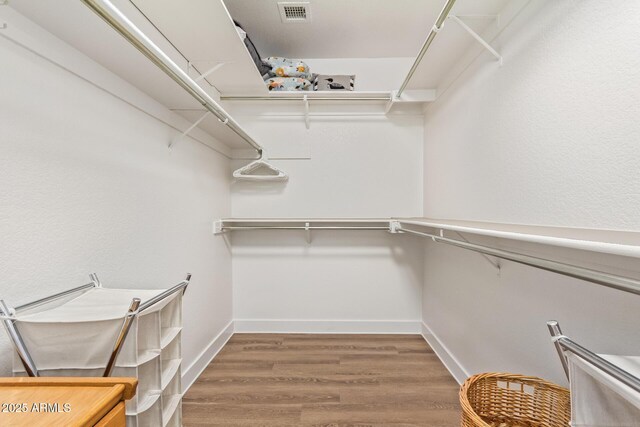 24832 S Boxwood Dr, Sun Lakes, AZ 85248 - walk in closet featuring visible vents and wood finished floors