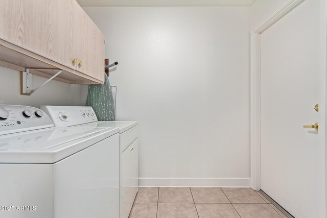 24832 S Boxwood Dr, Sun Lakes, AZ 85248 - clothes washing area with baseboards, cabinet space, washing machine and clothes dryer, and light tile patterned floors