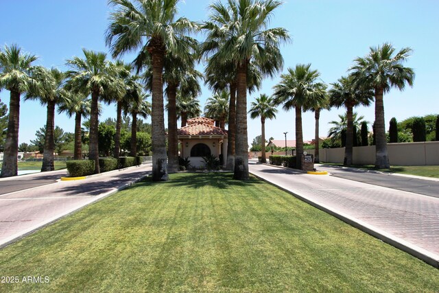 24832 S Boxwood Dr, Sun Lakes, AZ 85248 - view of front of home featuring a tiled roof, a front yard, fence, and stucco siding