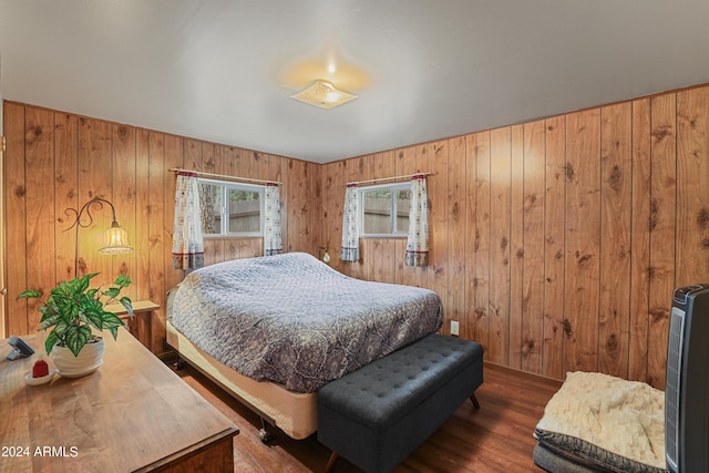 bedroom featuring dark wood finished floors