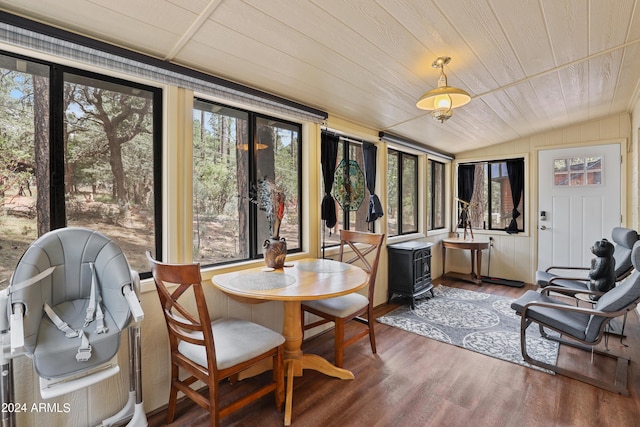 sunroom with wood ceiling, vaulted ceiling, and plenty of natural light