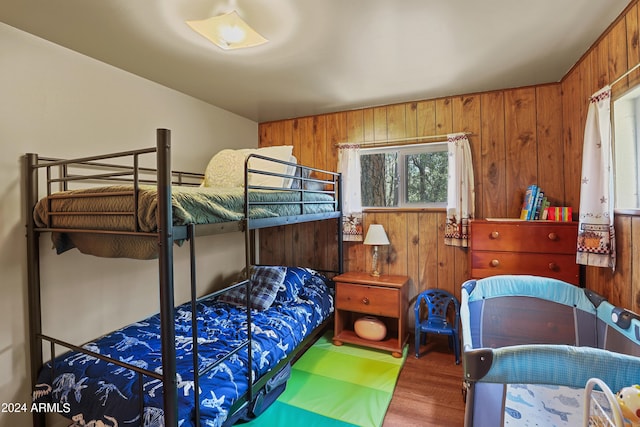 bedroom with wooden walls