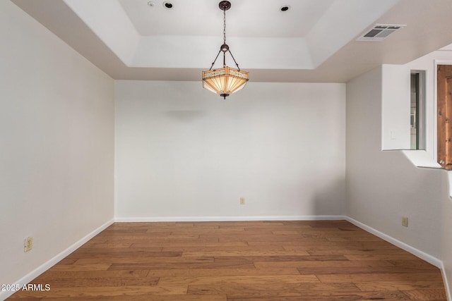 13600 N Fountain Hills Blvd Unit 501, Fountain Hills, AZ 85268 - unfurnished room with a tray ceiling and wood finished floors
