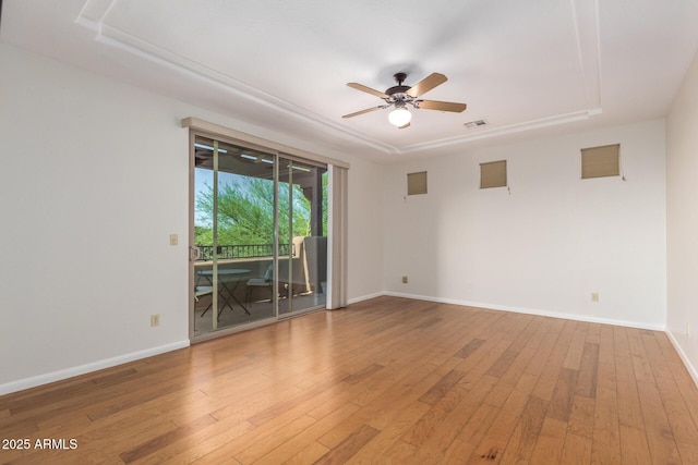 13600 N Fountain Hills Blvd Unit 501, Fountain Hills, AZ 85268 - spare room featuring a raised ceiling, wood-type flooring, and ceiling fan