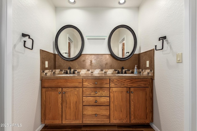 13600 N Fountain Hills Blvd Unit 501, Fountain Hills, AZ 85268 - bathroom featuring decorative backsplash, double vanity, wood finished floors, recessed lighting, and a textured wall
