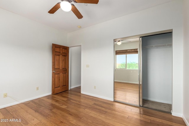 13600 N Fountain Hills Blvd Unit 501, Fountain Hills, AZ 85268 - unfurnished bedroom featuring wood finished floors, a closet, and ceiling fan