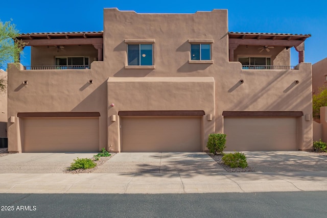 13600 N Fountain Hills Blvd Unit 501, Fountain Hills, AZ 85268 - pueblo-style home featuring a balcony, stucco siding, and an attached garage