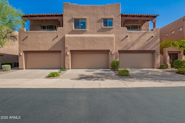 13600 N Fountain Hills Blvd Unit 501, Fountain Hills, AZ 85268 - adobe home featuring a balcony, stucco siding, and an attached garage