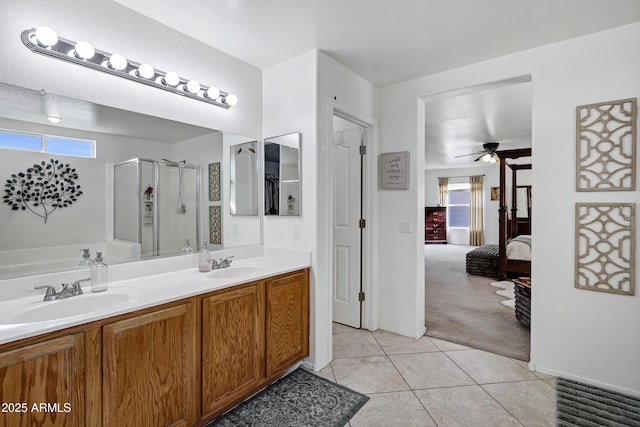 28014 N Jade St, San Tan Valley, AZ 85143 - ensuite bathroom featuring a ceiling fan, tile patterned floors, a sink, and a shower stall