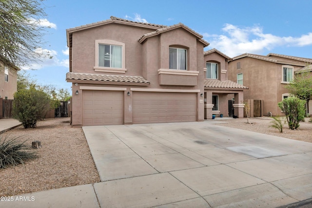 28014 N Jade St, San Tan Valley, AZ 85143 - mediterranean / spanish-style house featuring a tile roof, concrete driveway, stucco siding, fence, and a garage
