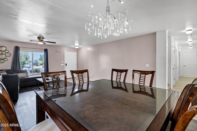 28014 N Jade St, San Tan Valley, AZ 85143 - dining space with wood finished floors and ceiling fan with notable chandelier