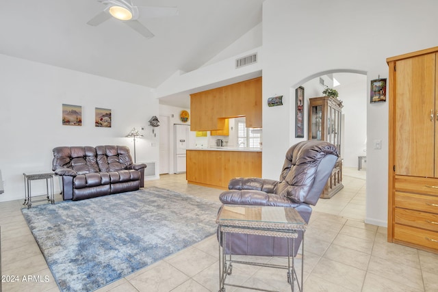 living room featuring light tile patterned flooring, high vaulted ceiling, and ceiling fan