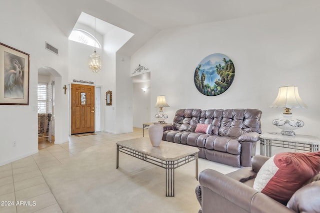 living room featuring lofted ceiling and light tile patterned floors