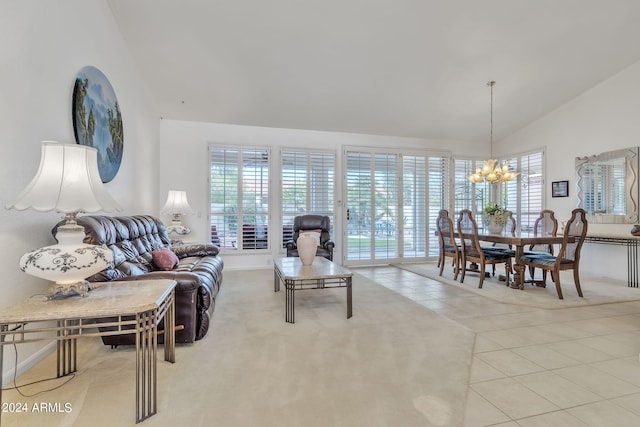 tiled living room featuring a wealth of natural light, lofted ceiling, and a notable chandelier